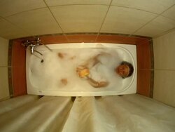 Woman bathing in a bath Stock Footage