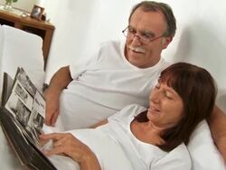 HD: Senior Couple Watching Photo Album Stock Footage