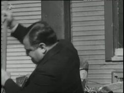New York City Mayor Fiorello LaGuardia destroys slot machines with a sledgehammer and throws them in the river. News Clip