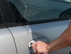 Woman opening the car door & getting in Stock Footage