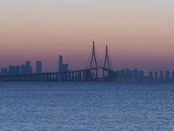 WS View of business district and Incheondaegyo Bridge at sunrise / Songdo, Incheon, South Korea Stock Footage