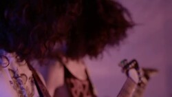 Heavy metal band play guitars and bang their heads in unison in slow motion Stock Footage