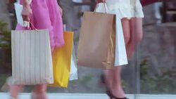TS Two women with shopping bags crossing a bridge Stock Footage