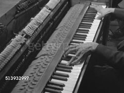 1952: NEW ORLEANS: FRENCH QUARTER: Angled TD MS Dixieland Jazz band male musician brown skin hands w/ long fingers playing open front upright piano w/ strikers hitting strings, SOT accompanying drums then horns joining in. Instructional Video