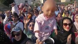 Giant puppets pull in Tehran crowds News Clip
