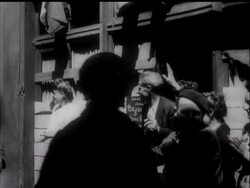 ALLIES APPLY SQUEEZE TO FALAISE GAP - VS artillery being fired, troops running behind tank, tanks in woodland, armoured vehicles moving through woodland, troops walking past mines, CUs of signs in Ger News Clip