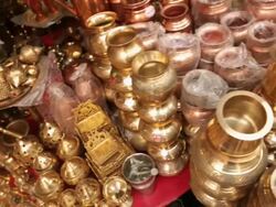 Brass articles on display in a market stall, Haridwar, Uttarakhand, India Stock Footage
