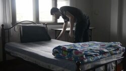 Young man traveler in the hostel Stock Footage