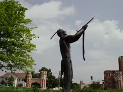 Bronze statue of native american holding peace pipe, "May We Have Peace," by Allan Houser located at The University of Oklahoma Stock Footage