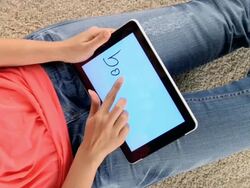 MS Woman choosing book and turning pages on ipad / London, London, United Kingdom Stock Footage