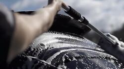 Slow motion of washing cleaning car rear window Stock Footage