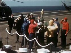 1962 US president Kennedy and Robert McNamara greeting officers on deck of aircraft carrier Stock Footage