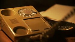 CU of man taking call on old rotary phone Stock Footage