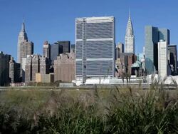 Skyline of Midtown Manhattan seen from the East River showing the Chrysler Building and the United Nations building, New York, United States of America Stock Footage
