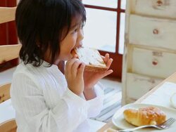 MS Girleating bread / Fujikawaguchiko, Yamanashi, Japan Stock Footage