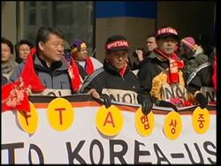 US and Korean union members protest against ongoing free trade negotiations News Clip