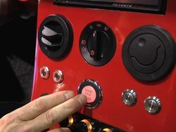 CU Engine start and stop button of Li-Ion Motors Corp Inizio at Detroit Auto Show / Detroit, Michigan, USA Stock Footage