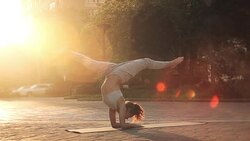 Young Woman Doing Yoga Meditation Exercises at Sunset Stock Footage