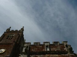 T/L Kenton church tower and cirrus clouds passing through summer sky, UK Stock Footage