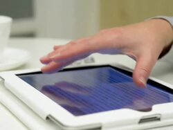 Dolly,L to R Female using tablet computer Stock Footage