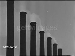 1947: CLEVELAND INDUSTRY: OHIO: VS Industrial plants and factories along harbor, smoke from stacks. INT VS Workers working in steel factory, machines pressing thin steel sheets (flexible). Metals, metal, mill, OH Instructional Video