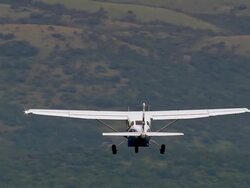 MS AERIAL TS Shot of Light aircraft flying over with forest / iSimangaliso Wetland Park, Kwazulu Natal, South Africa Stock Footage