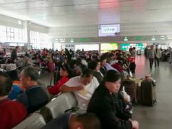 Crowds of Passengers waiting at Beijing West Train Station Stock Footage