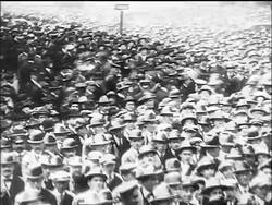 B/W 1917 high angle PAN crowd in hats at war bonds rally / WW I / documentary Stock Footage