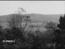 1950s: UNFERTILIZED FARMLAND: VS Wide expanses of unfertilized land, landscape, trees, mountains in distance. United States, USA, agriculture, farm, farming, countryside, country, farmland, soil, fertilizer Instructional Video