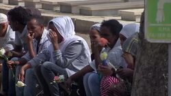 Mourners at funeral for Migrants in Addolerata News Clip