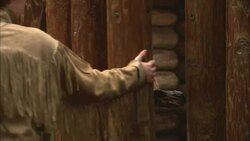 A fur trapper opens a wooden door. Stock Footage