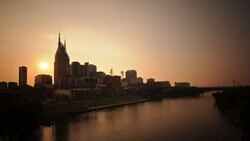 The Nashville skyline reflects in the Cumberland River. Stock Footage