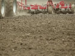 Large Eight Tire Tractor Plowing Farm Field Stock Footage