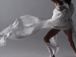 woman with silk draped around her dancing Stock Footage