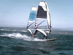 Female and male windsurfer windsurfing Stock Footage
