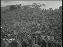 1944: U.S. GENERAL FREDERICK IRVING: EXT VS U.S. Army Major General Frederick A. Irving (1894-1995) at podium speaking to soldiers about campaign & combat (SOT), large groups of soldiers listening (part of 24th Infantry Division). WWII, Pacific Instructional Video