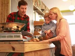 Mother and child in Grocery shop paying with credit card Stock Footage