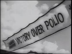 B/W 1962 low angle close up "Victory Over Polio" banner with clouds in sky in background / Texas / newsreel Stock Footage