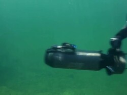 MS Shot of Special operation forces combat diver with DVP diver propulsion vehicle during underwater operation / Open water Stock Footage