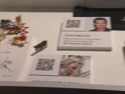 ATMOSPHERE: auction items at eBay Celebrity And Brad Pitt's Make It Right Celebrate Pop-Up Gallery Exhibition At New York's Chelsea Market on 02/09/2012 in New York Stock Footage