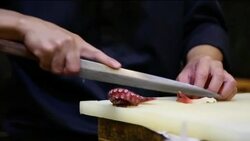 Chef cutting squid. Stock Footage