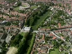 MS AERIAL DS ZO Traffic moving under Menin Gate / Flanders, Belgium Stock Footage