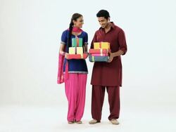 Portrait of a punjabi couple showing lots of gift box  Stock Footage