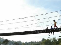 Time lapse of People walk on a rope bridge Stock Footage