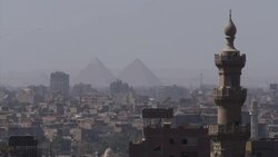 Egypt Stock Shots - Stock Shots Giza Pyramids through haze across town News Clip