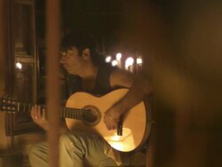 Slow motion woman dancing and guitarist playing in candlelit room, Spain, pull focus (Individual frames may also be used as a still image. Each frame in its raw state is about 6MB or about 12MB as a 16 bit TIFF) Stock Footage