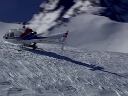 WS AERIAL View of People getting down in to helicopter / Switzerland Stock Footage