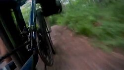 A cyclist pedals a bicycle down a mountain path. Stock Footage