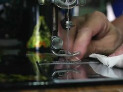 ï»¿Seamstress working on sewing machine Stock Footage