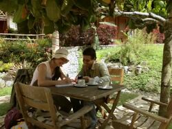MS Couple making notes on outdoor dinning table / Quimbaya, Quindio, Colombia  Stock Footage